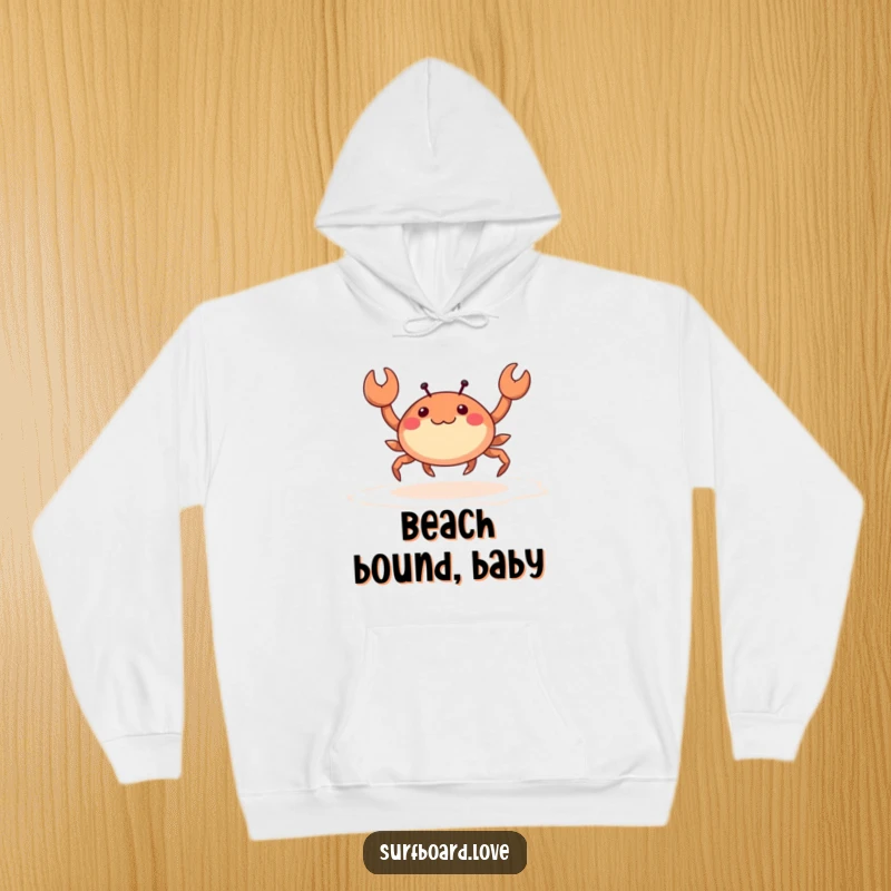 Funny happy crab with tiny legs skipping across wet sand, featured on a warm and humorous hoodie.