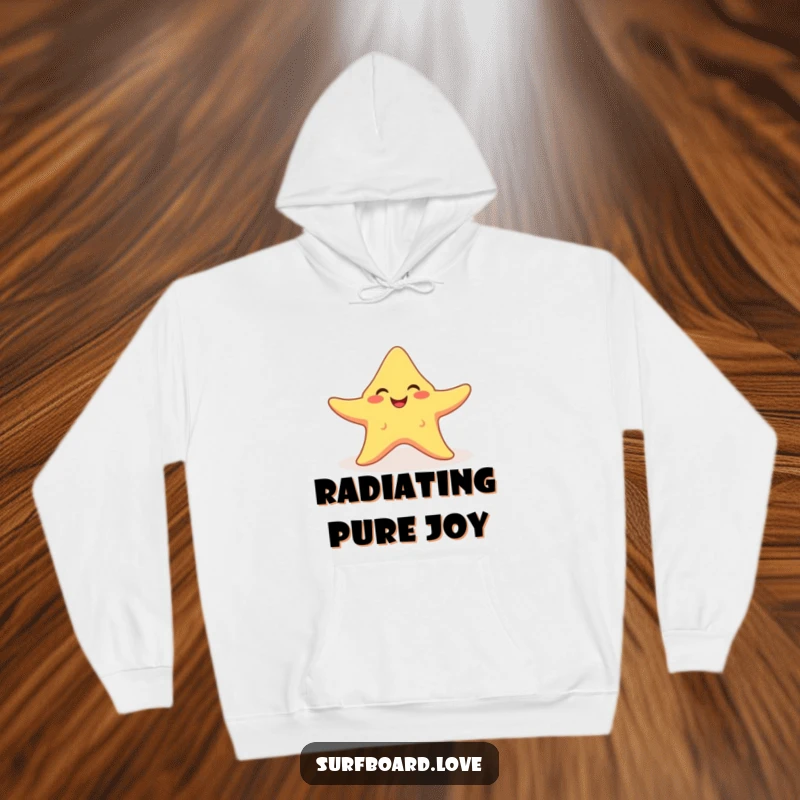 Funny smiling starfish with arms spread wide, catching a sunbeam, featured on a warm and humorous hoodie.